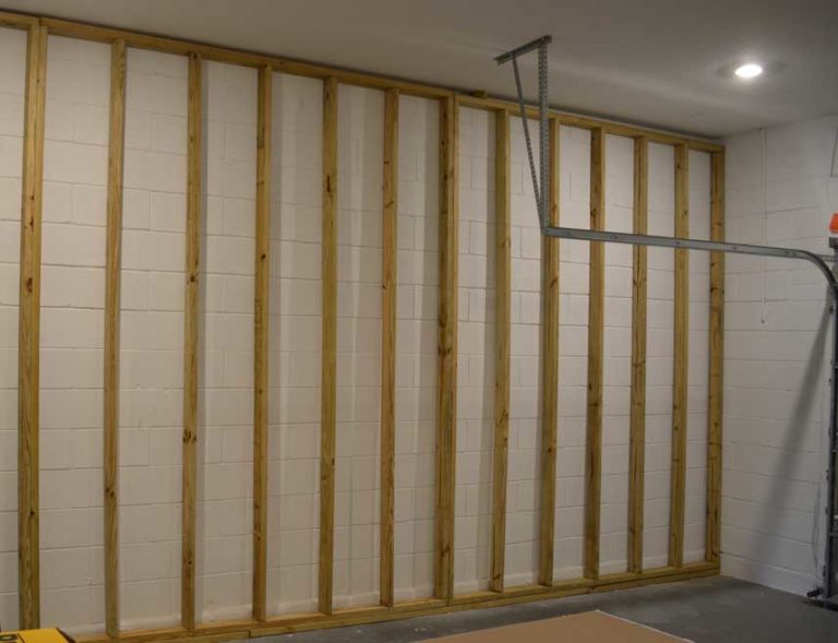 Framed garage wall in place