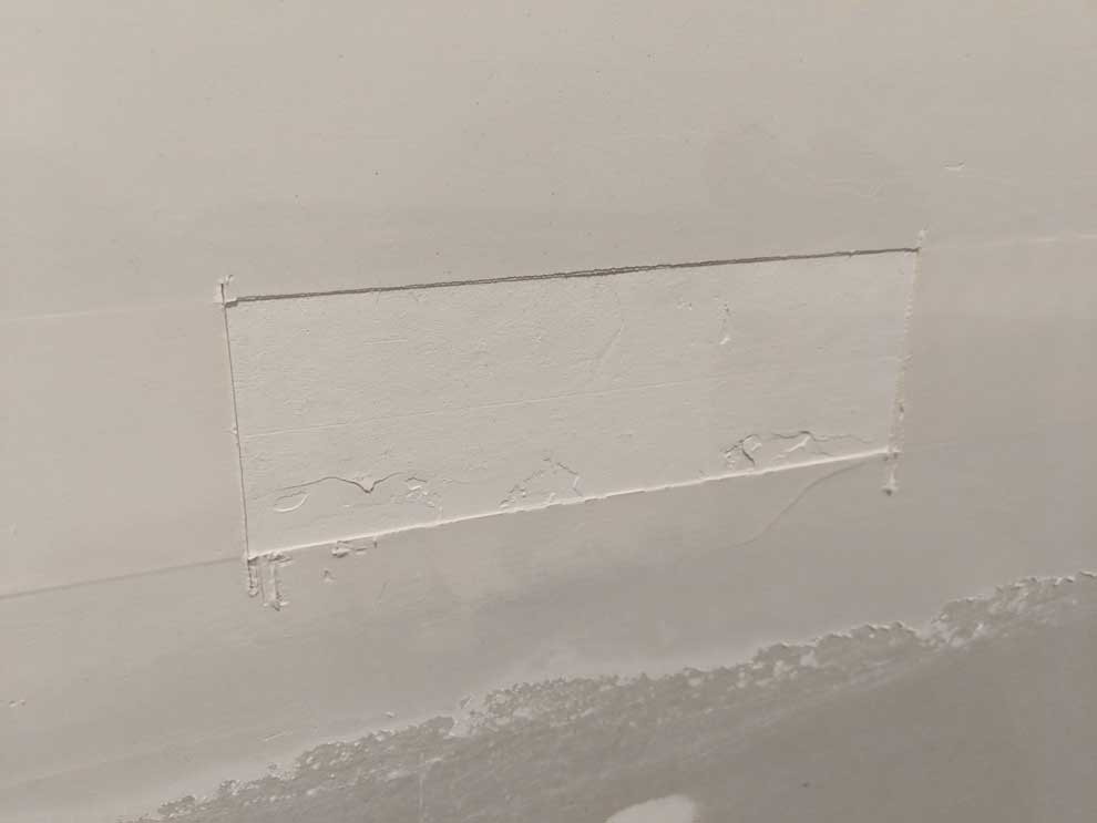 cut out the bubble in the drywall tape