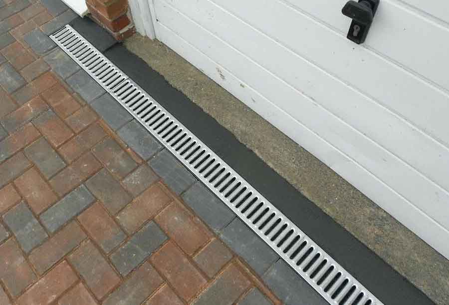 Trench drains can prevent water in your garage.