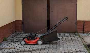 Storing lawn mower in garage - Feature Image