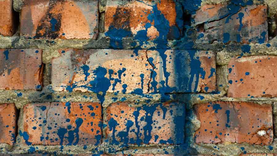 Paint splatter on a brick wall can be hard to remove. We discuss several methods how to remove paint from brick walls. 