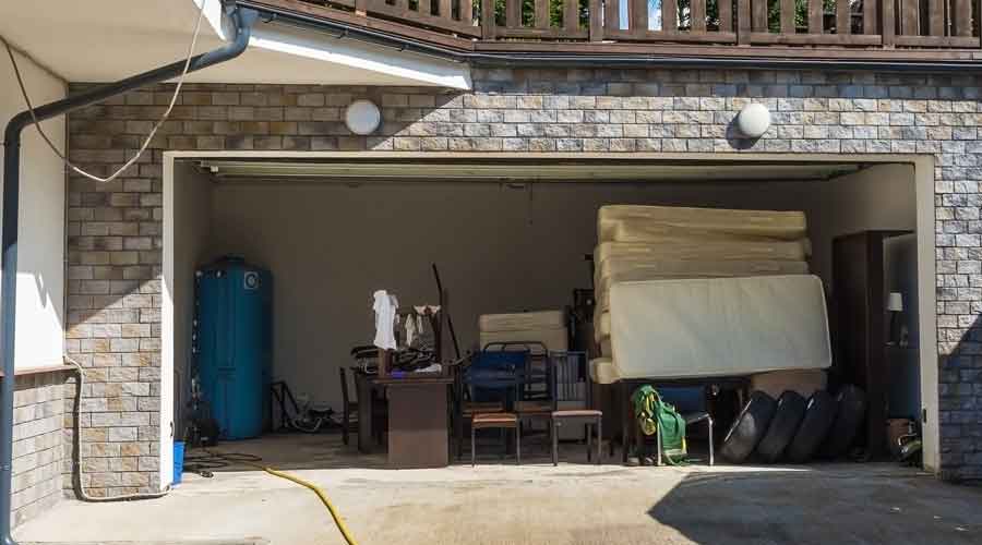 Mattresses stacked in a garage