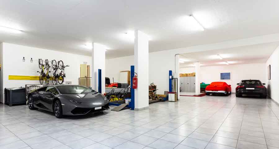A simple color scheme and bright lighting helps to make this garage look expensive.