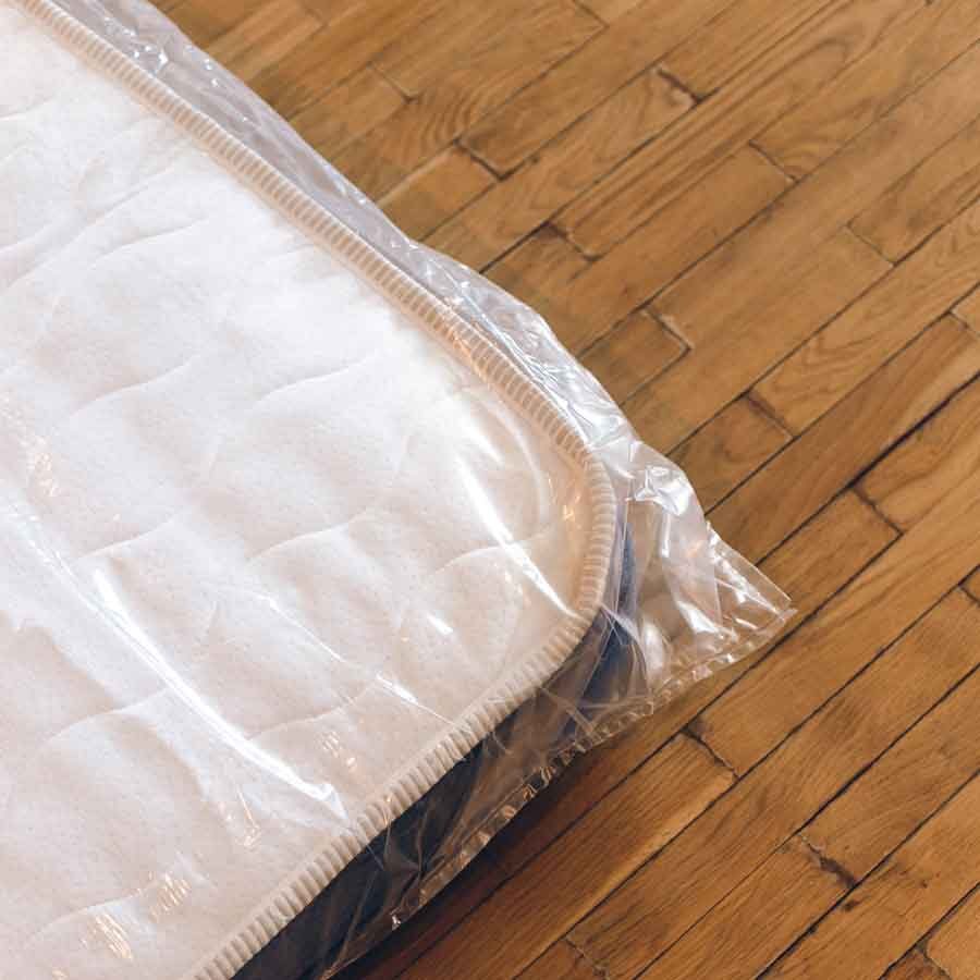 Mattress stored in plastic bag