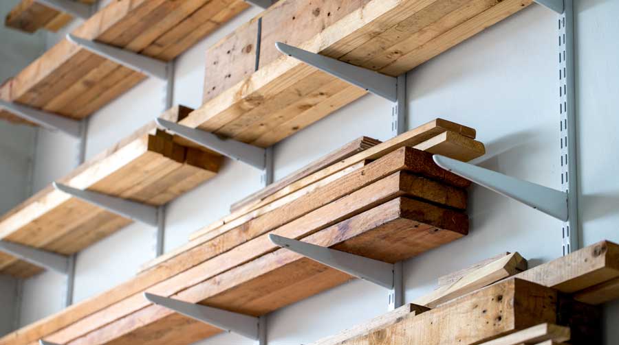 Garage ceiling lumber storage shelves