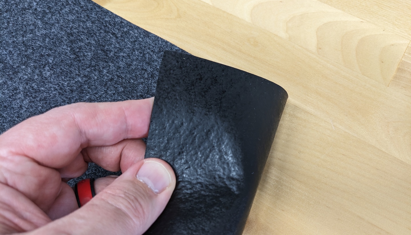 The Drymate oil spill mat has a rubber, anti-slip backing