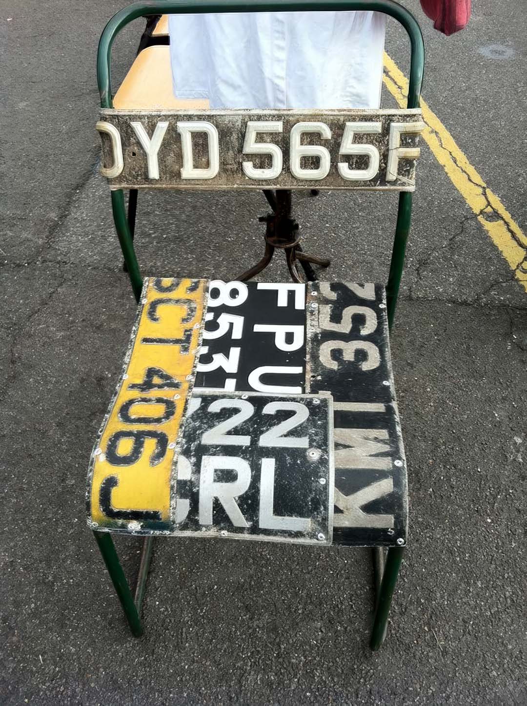 Small chair made from UK license plates