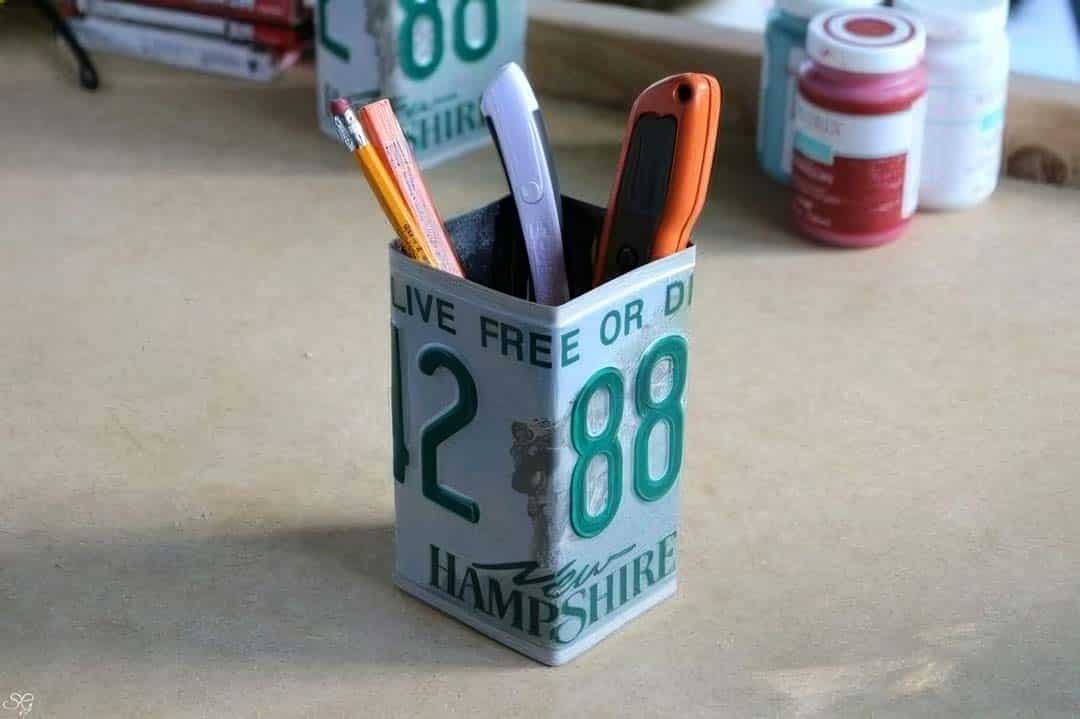 Paintbrush holder made from old license plates