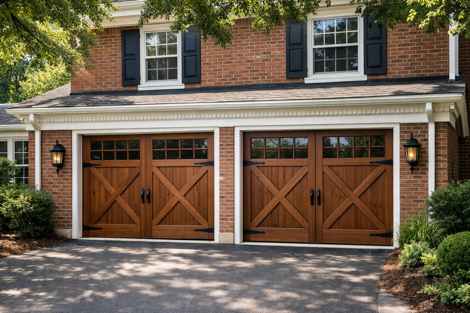 Colonial home with wooden carriage house garage doors and decorative hardware