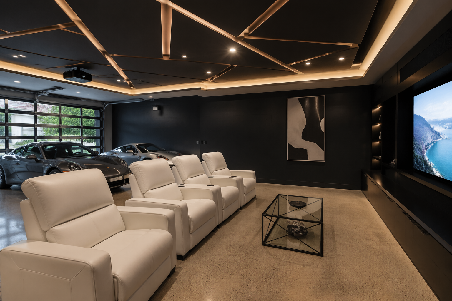 Contemporary garage theater with black accent wall and white leather recliners