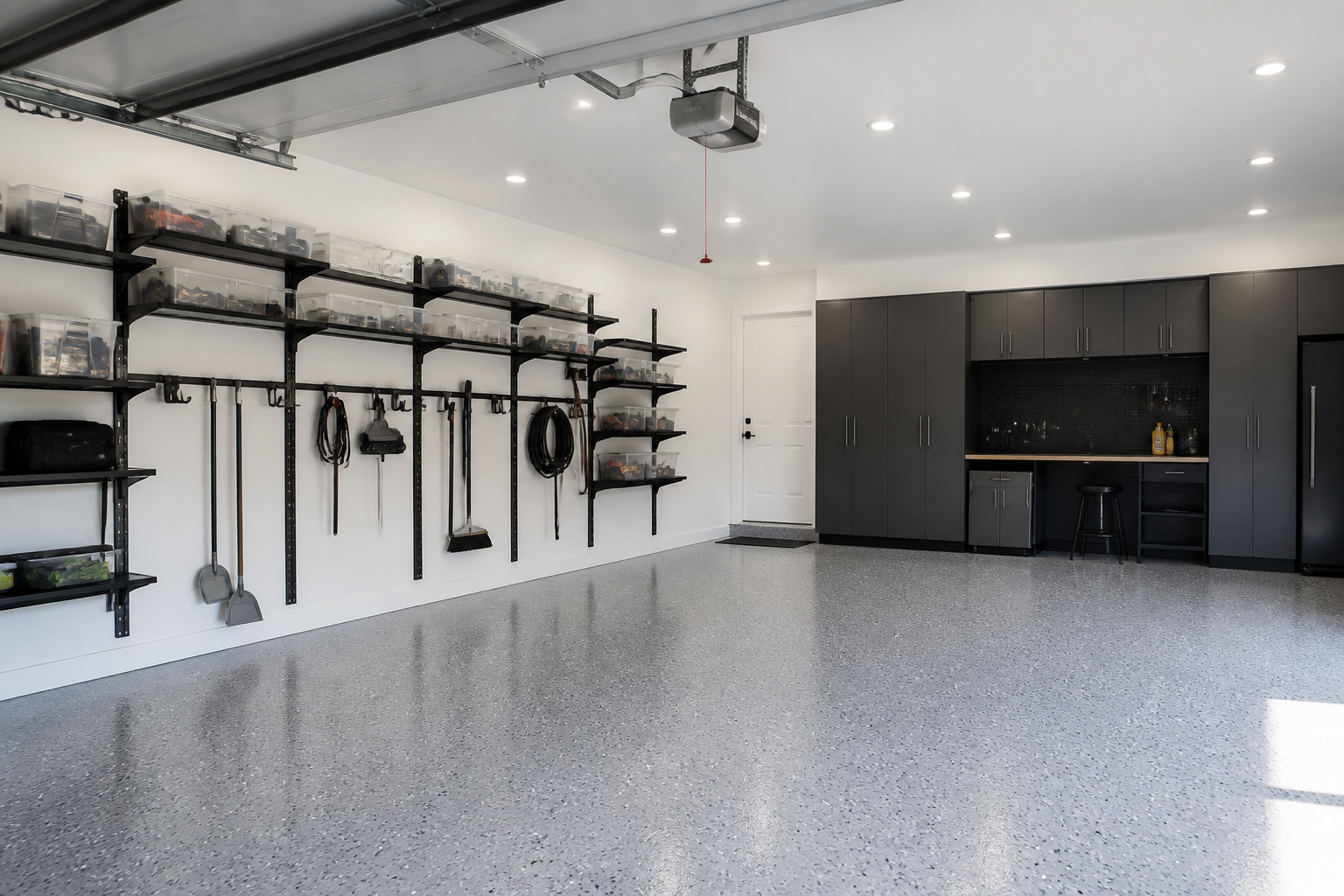 Black aluminum track wall system with adjustable shelves and storage boxes