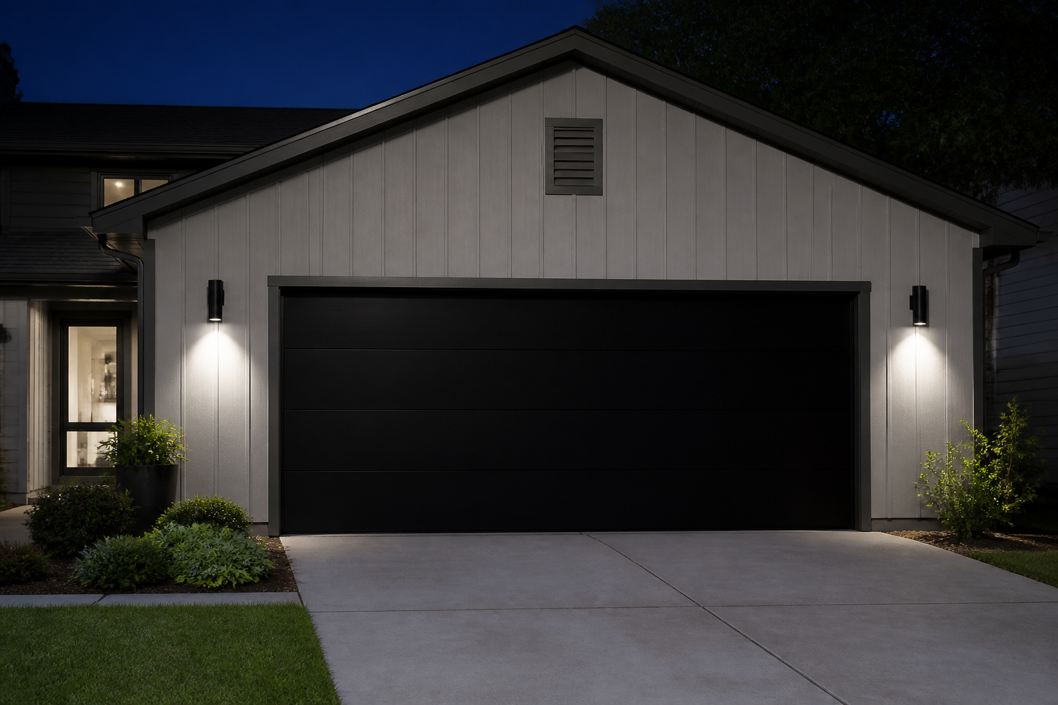 Modern garage with sleek black LED wall sconces creating dramatic downward lighting at night
