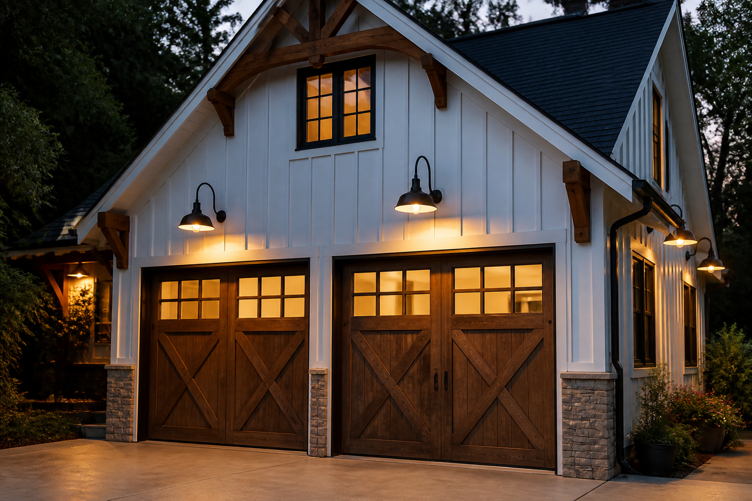 Farmhouse garage with classic black gooseneck barn lights and Edison bulbs on white siding