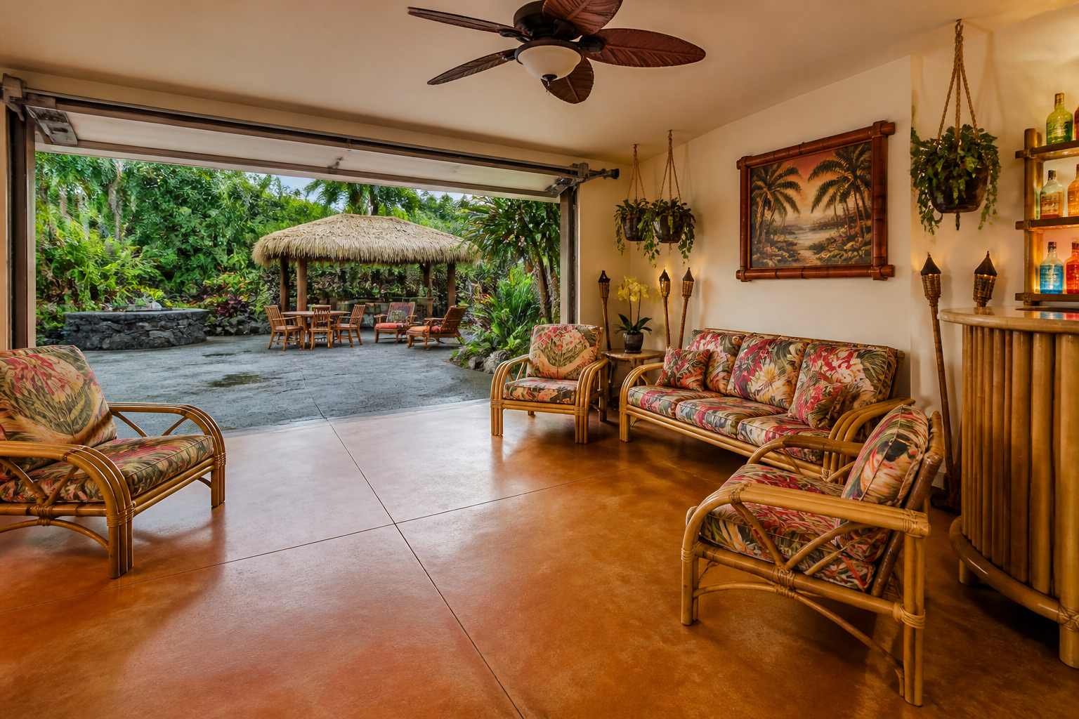 Tropical garage lounge with bamboo furniture, hanging plants, and terracotta stained concrete