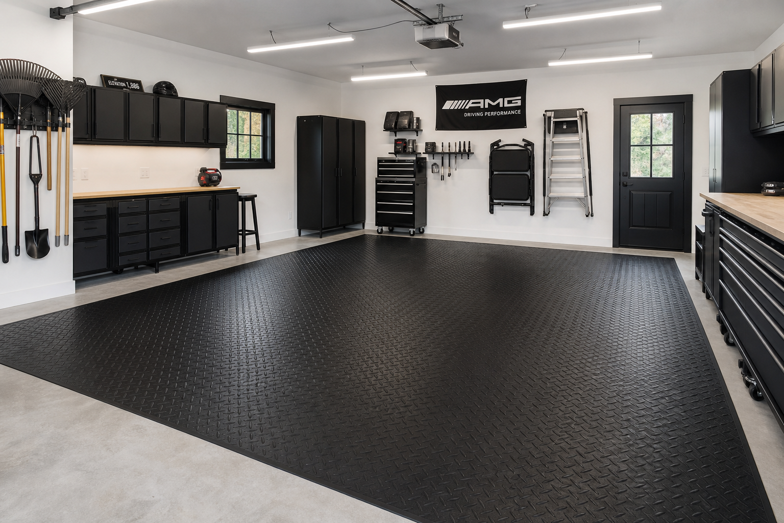 Roll-out garage floor mat with diamond plate pattern in modern garage