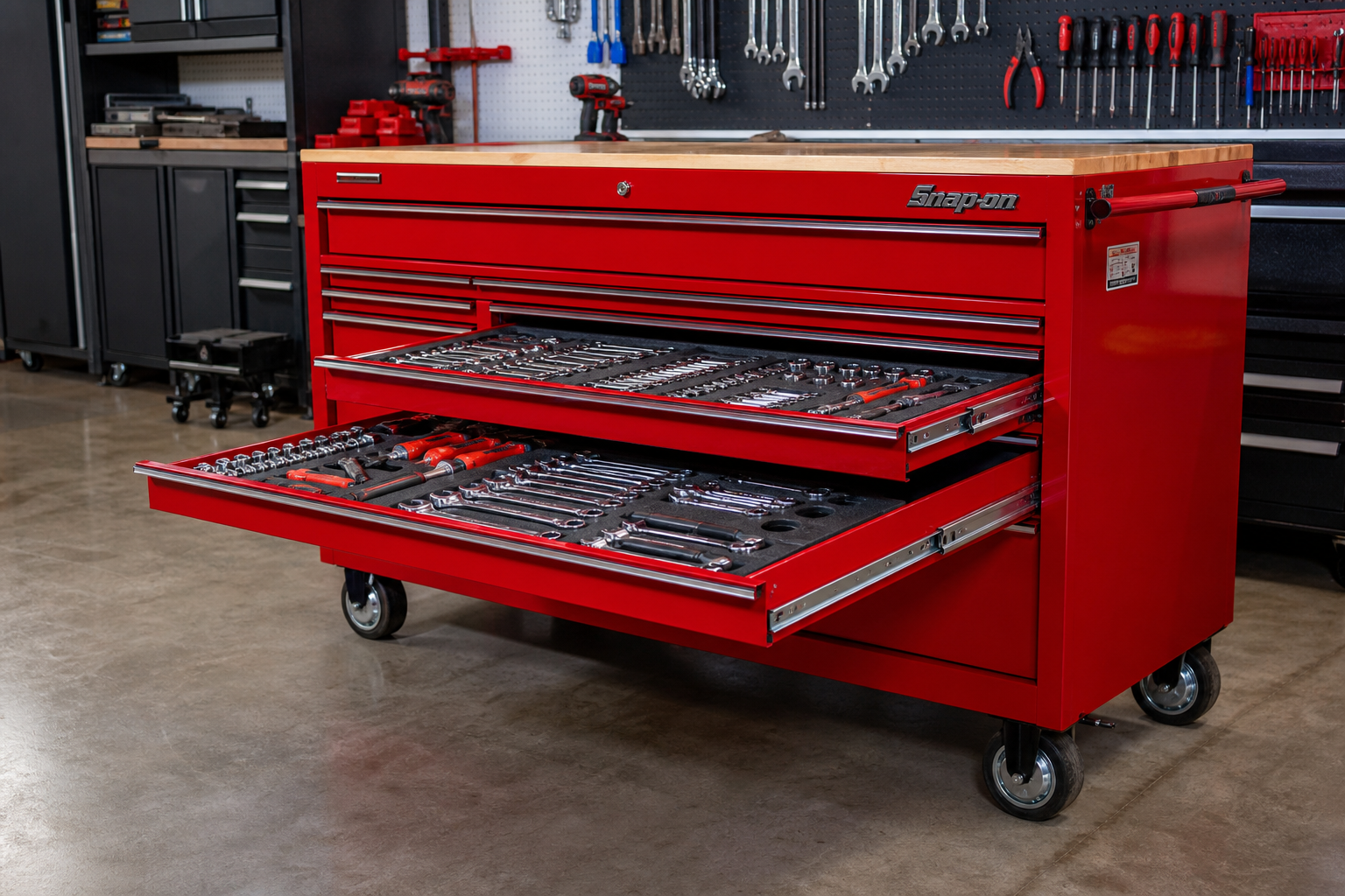 Red rolling tool chest with organized drawers in a garage workshop