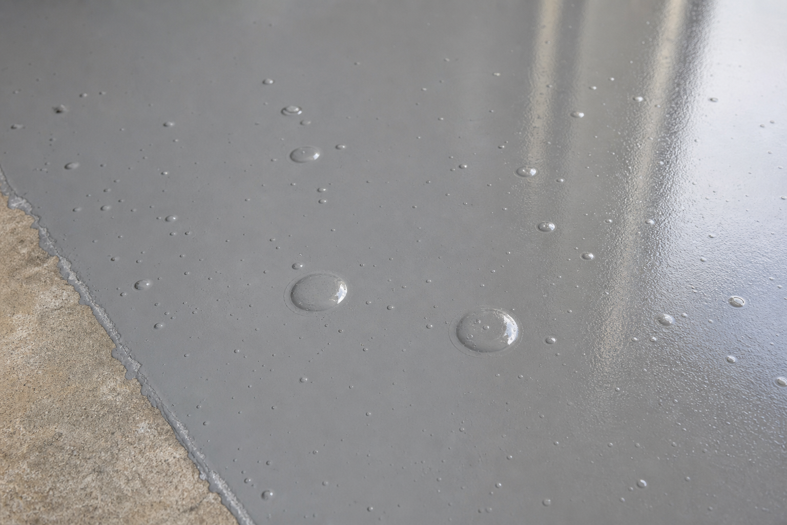 Close-up of epoxy garage floor showing air bubbles trapped under the surface coating