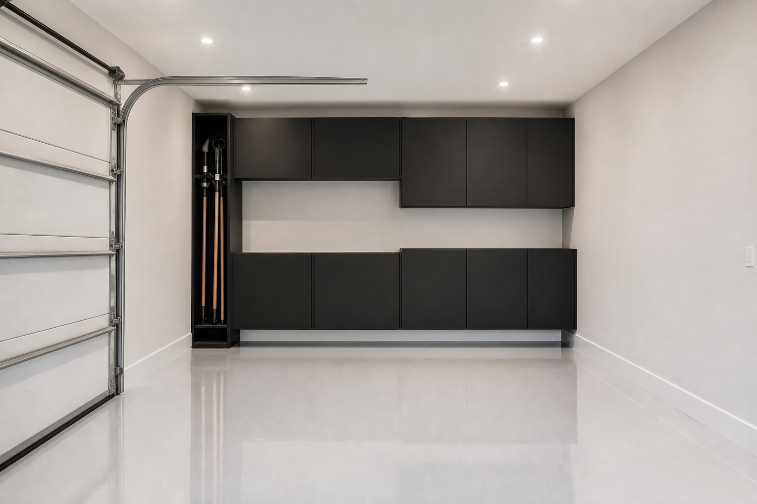 Staggered matte black modular wall cabinets in narrow single-car garage with white epoxy floor
