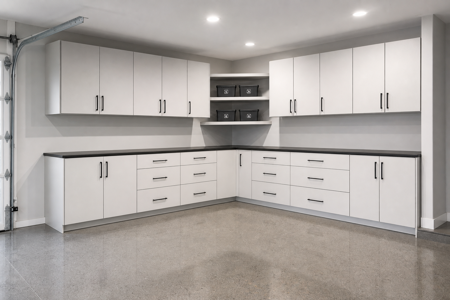 White L-shaped modular garage cabinet system with matte black handles and open shelving