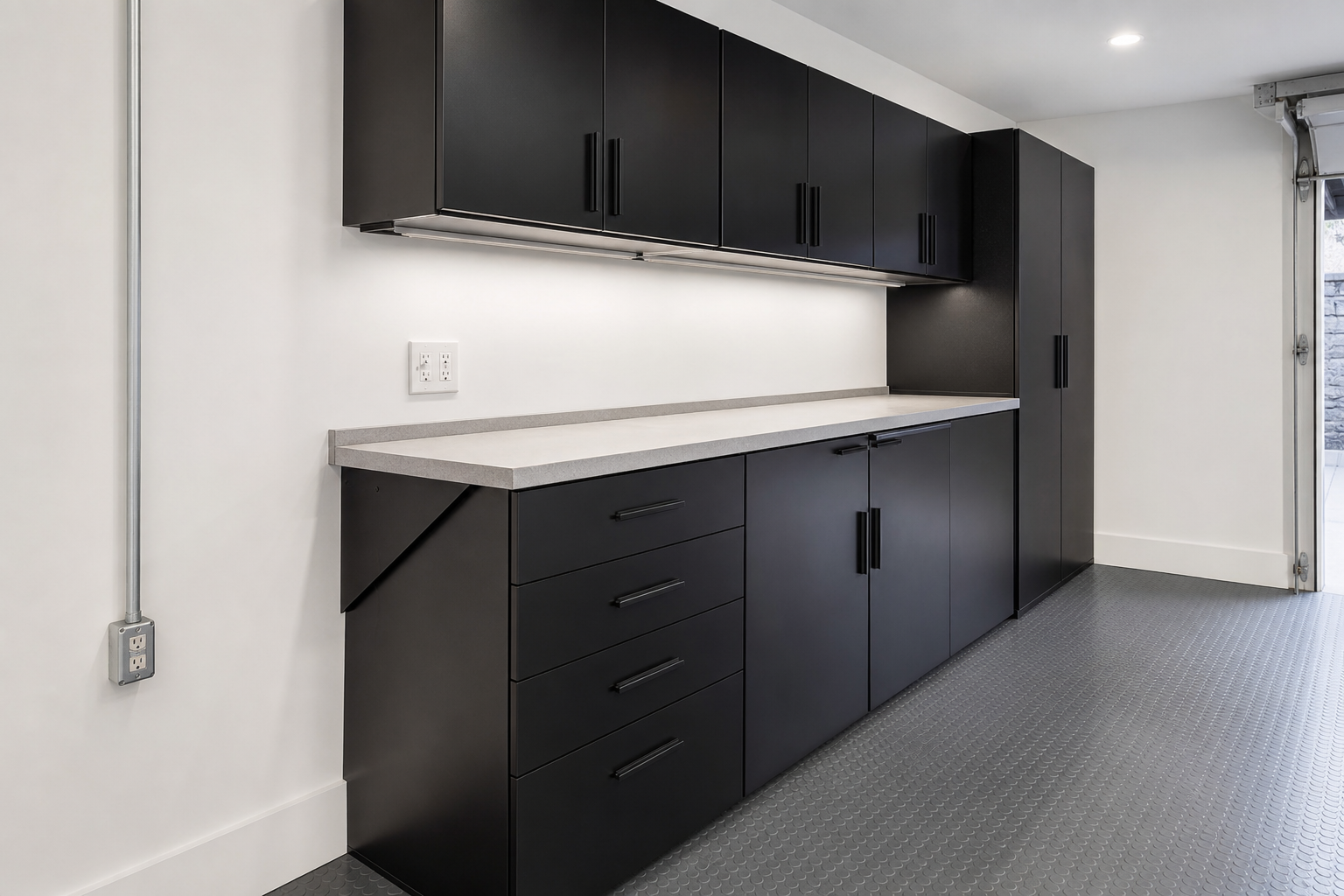 Black steel garage workbench with fold-down extension leaf and tall locker cabinet