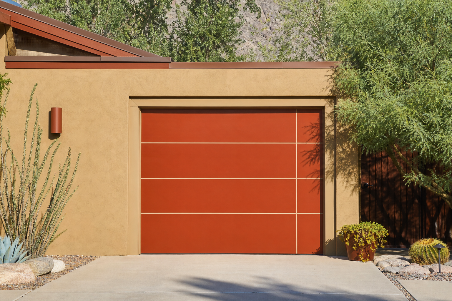Mid-century modern garage door in terracotta with cream thin-line trim on adobe home