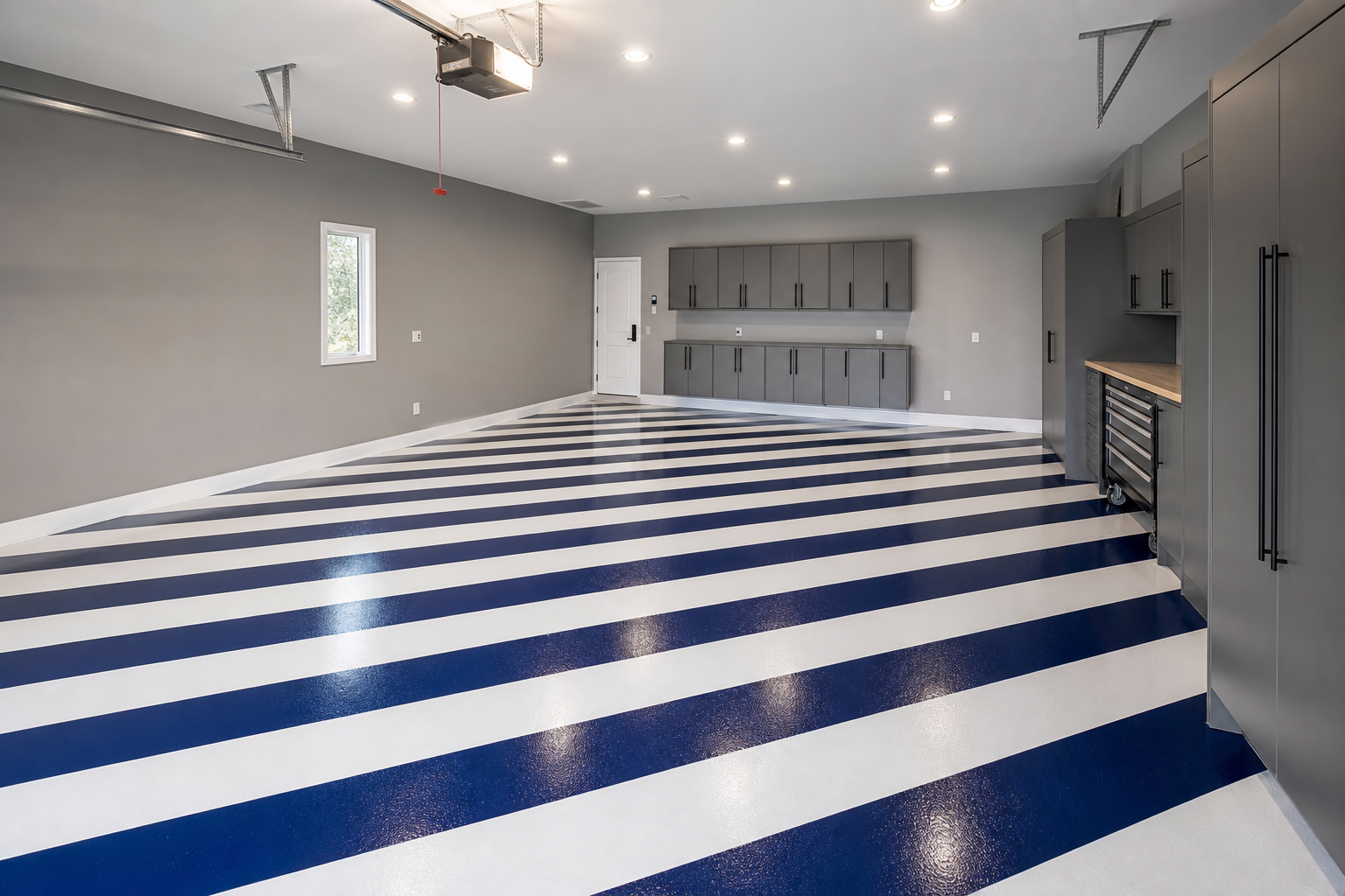 Garage floor with diagonal navy blue and white painted stripe pattern, glossy finish