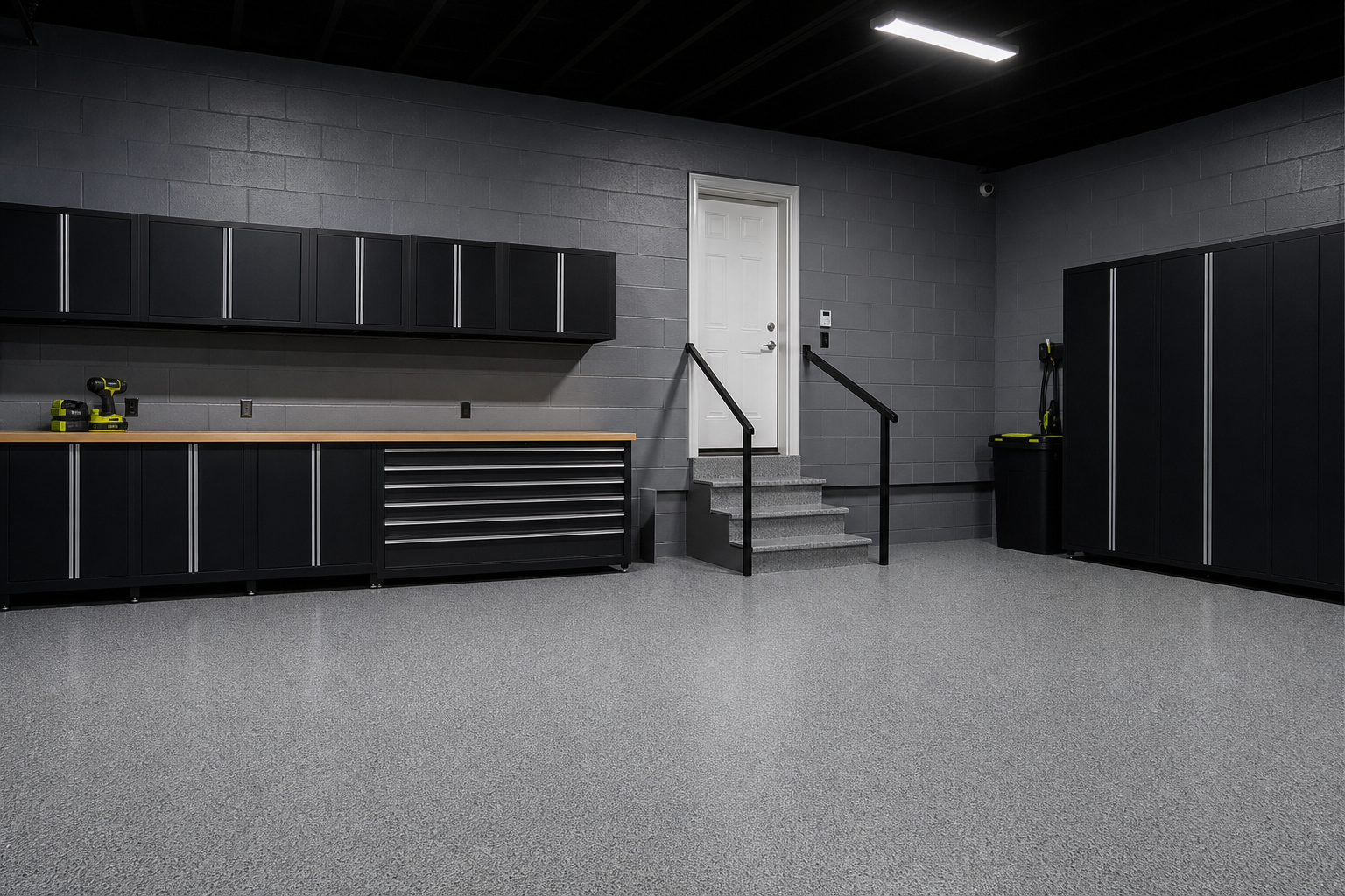 Concrete block garage walls painted with gray epoxy masonry paint showing sealed texture