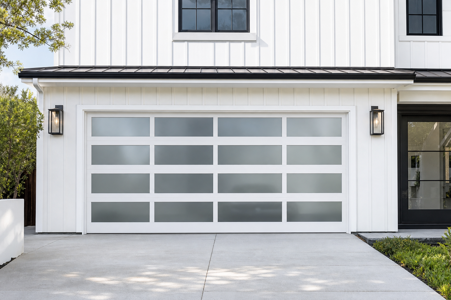 White aluminum framed glass garage door with horizontal rail emphasis on a modern farmhouse home